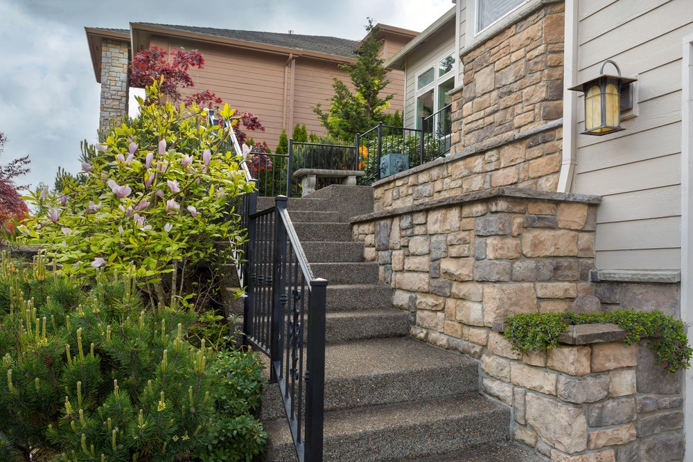 Close-up of a rustic stone wall texture, showcasing the natural patterns and earthy colors of the stones.