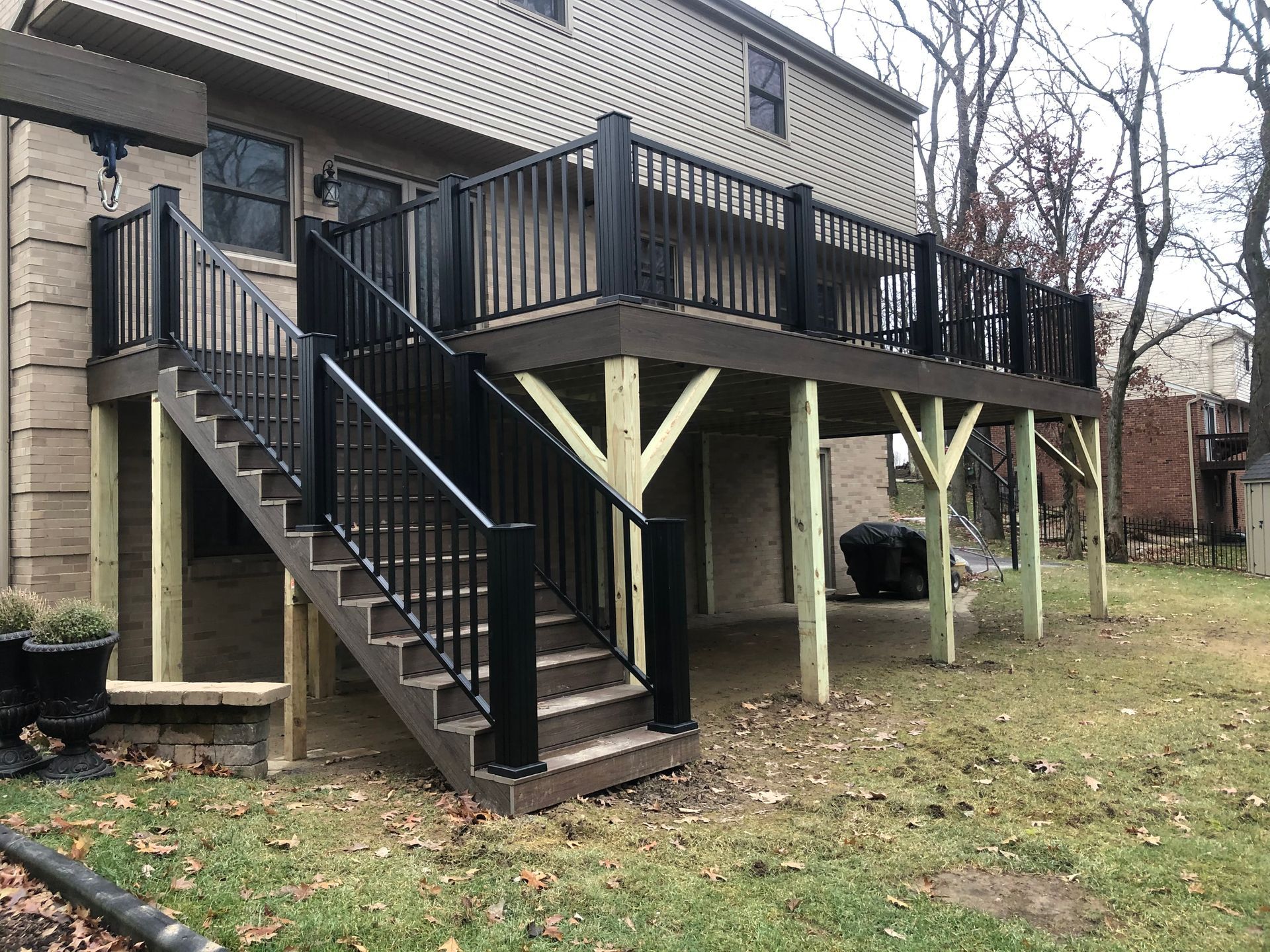A large deck with stairs leading up to it