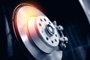 A close up of a brake disc on a car.