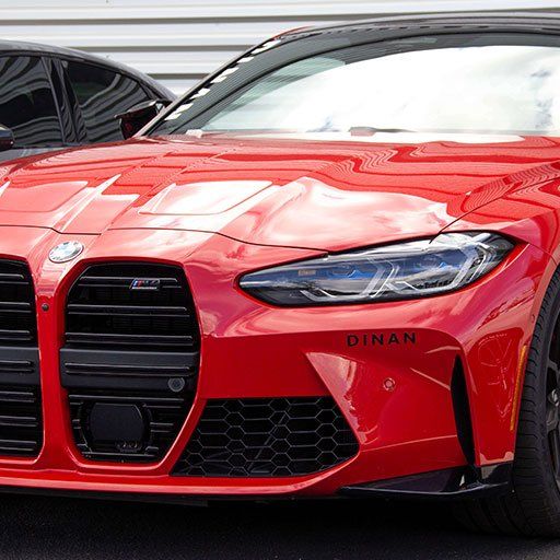 Red BMW Front Grille Closeup With Dinan Badge | Main Street Auto Shop