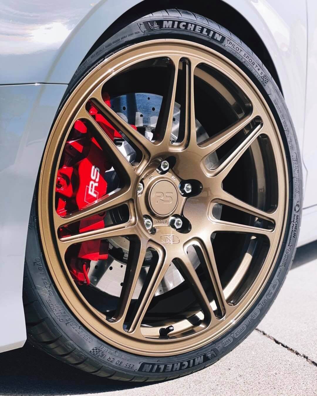 Bronze Neuspeed Alloy Wheel With Red Brake Calipers | Main Street Auto Shop