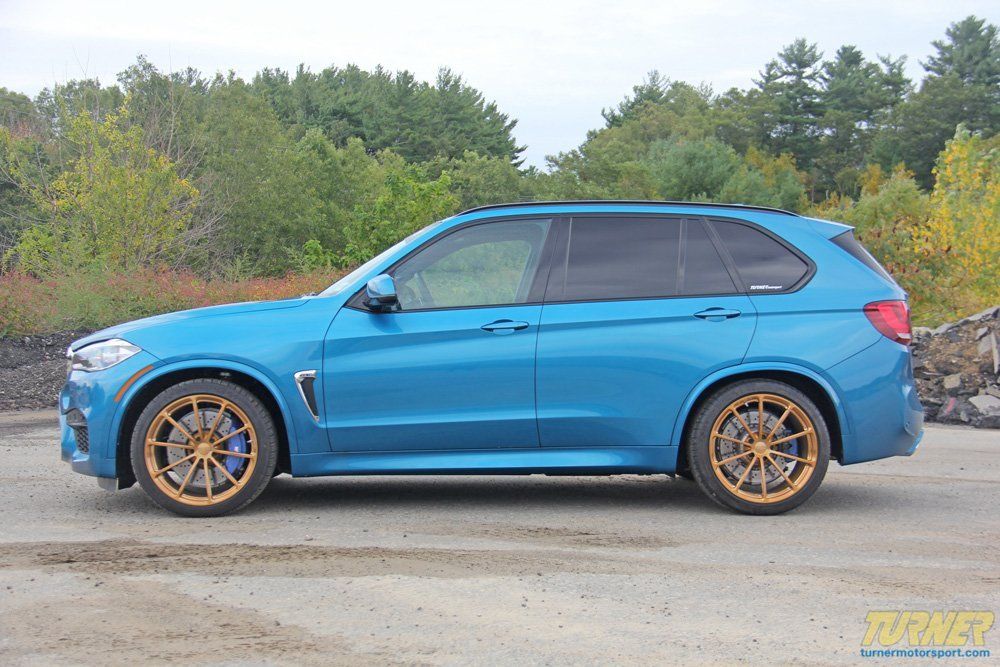 Blue BMW SUV With Bronze Wheels Parked Outdoors | Main Street Auto Shop