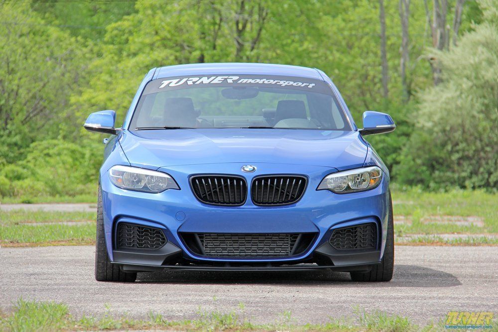 Blue BMW With Turner Motorsports Banner | Main Street Auto Shop