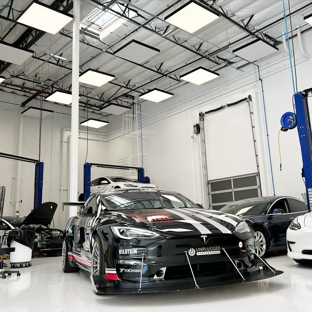 Black And White Race Car Inside Performance Shop | Main Street Auto Shop