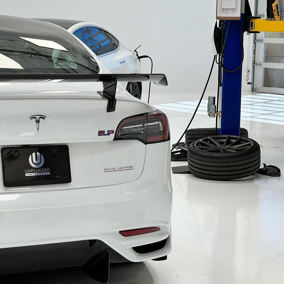 White Tesla Model X Rear View On Shop Floor | Main Street Auto Shop
