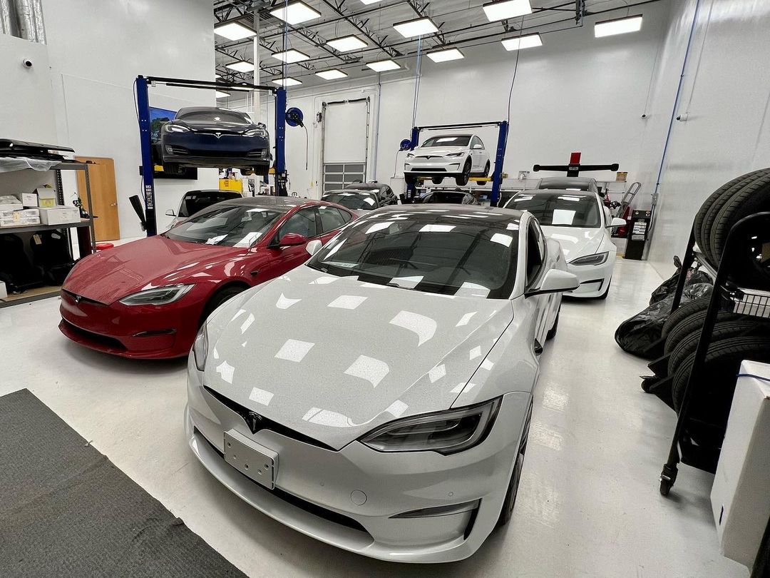 White Tesla Model 3 Parked In Auto Shop | Main Street Auto Shop