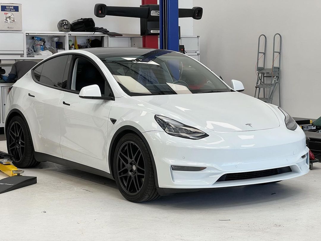 White Tesla Model 3 With Black Wheels In Garage | Main Street Auto Shop