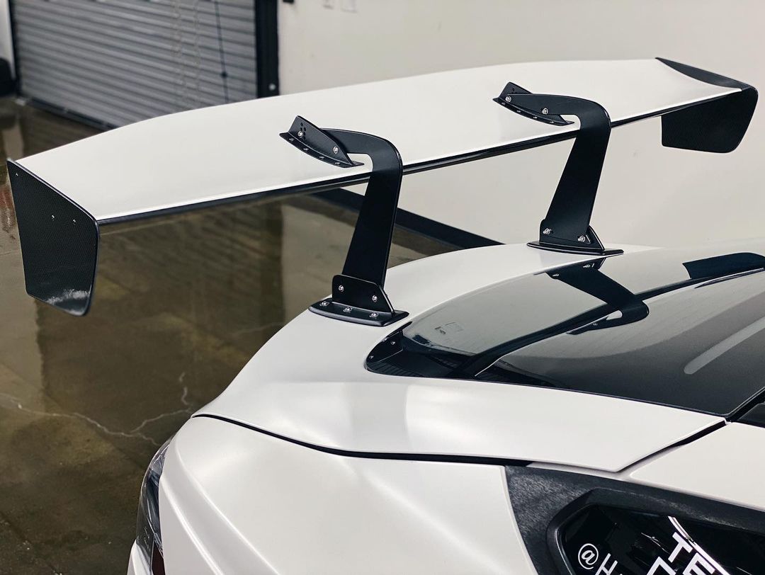 White Sports Car With Large Rear Spoiler | Main Street Auto Shop