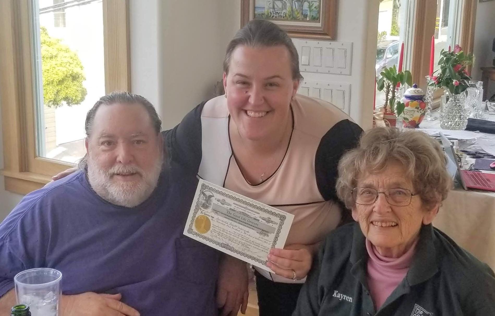 three people smiling together
