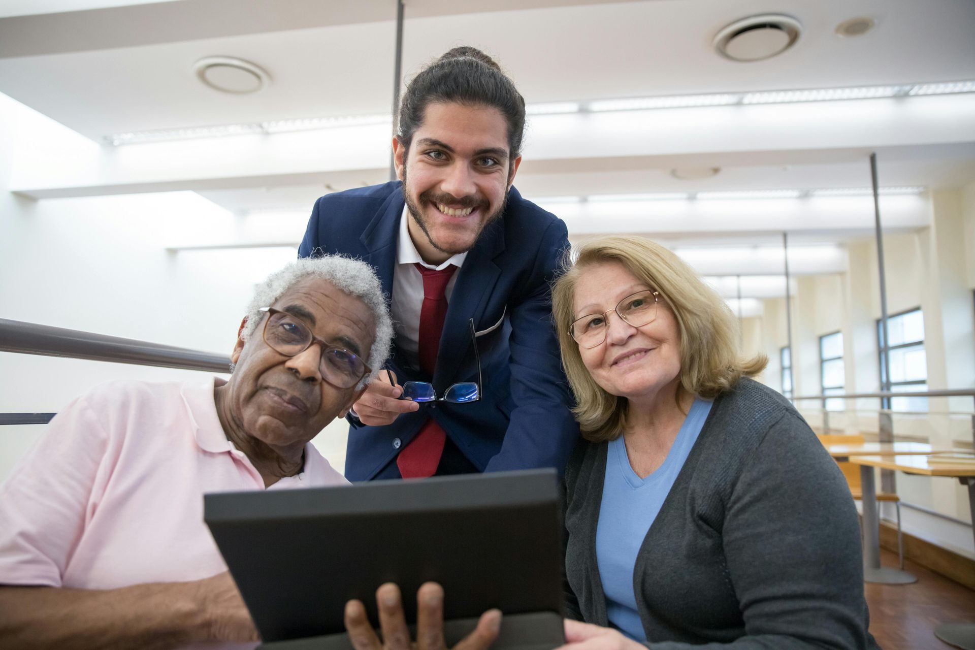 Three people smiling