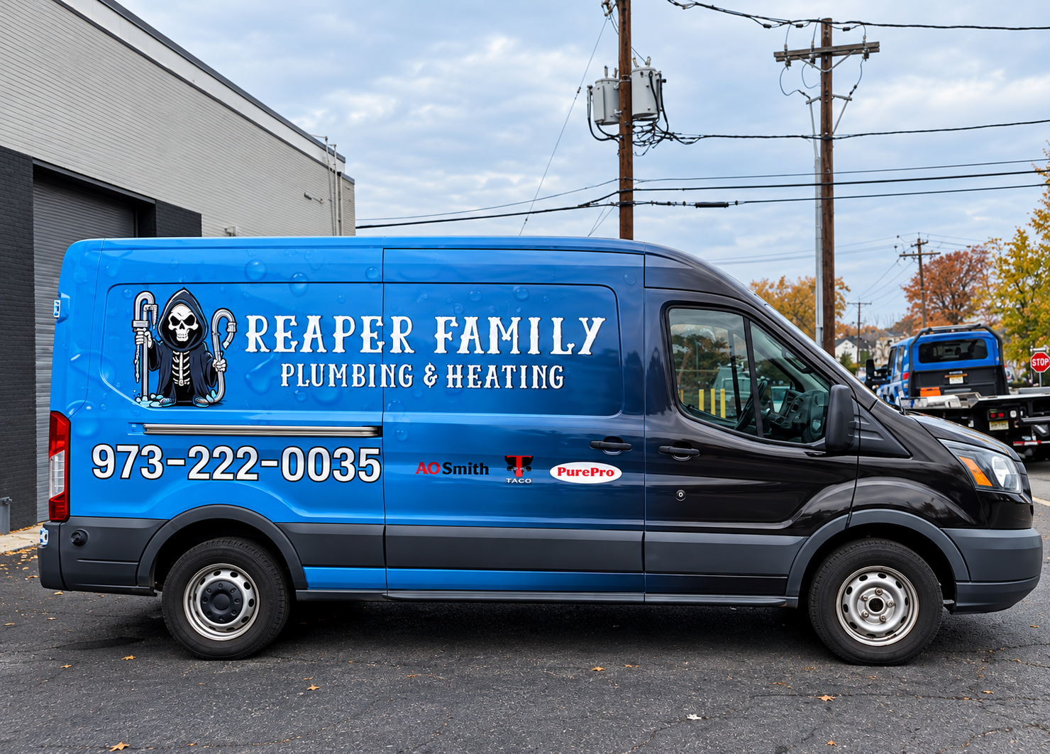 Blue Reaper Family Plumbing & Heating van parked outdoors with contact number on the side.