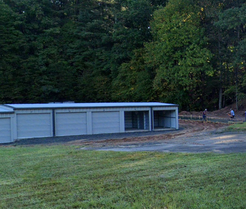 guardian storage units, two open at the end of the row