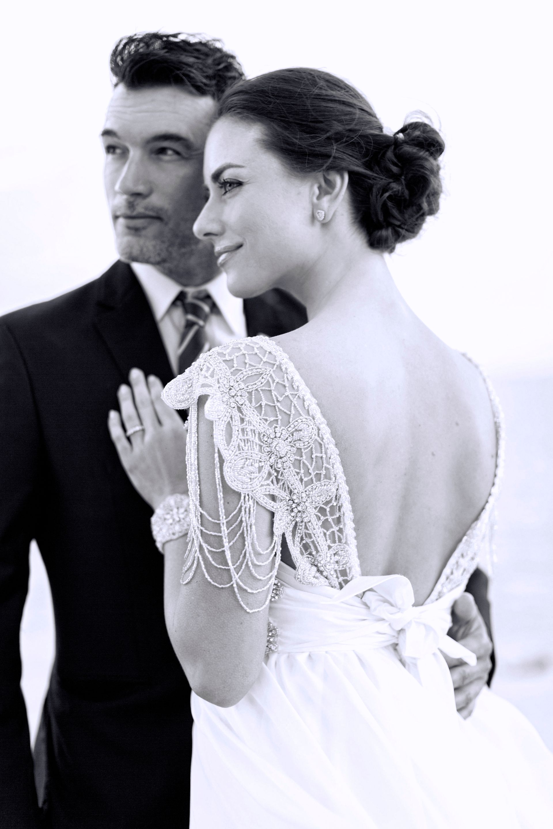 A black and white photo of a bride and groom