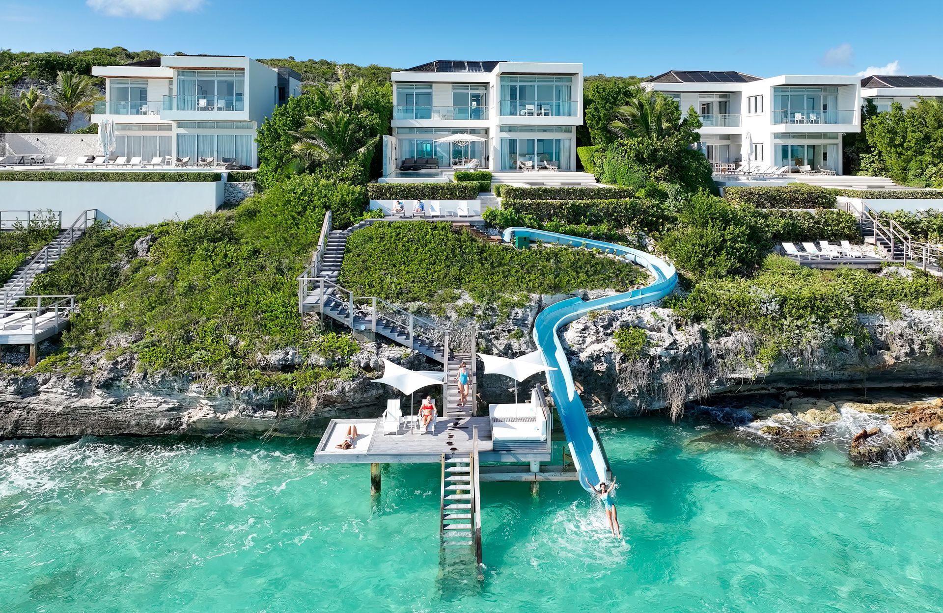 An aerial view of a resort with a water slide