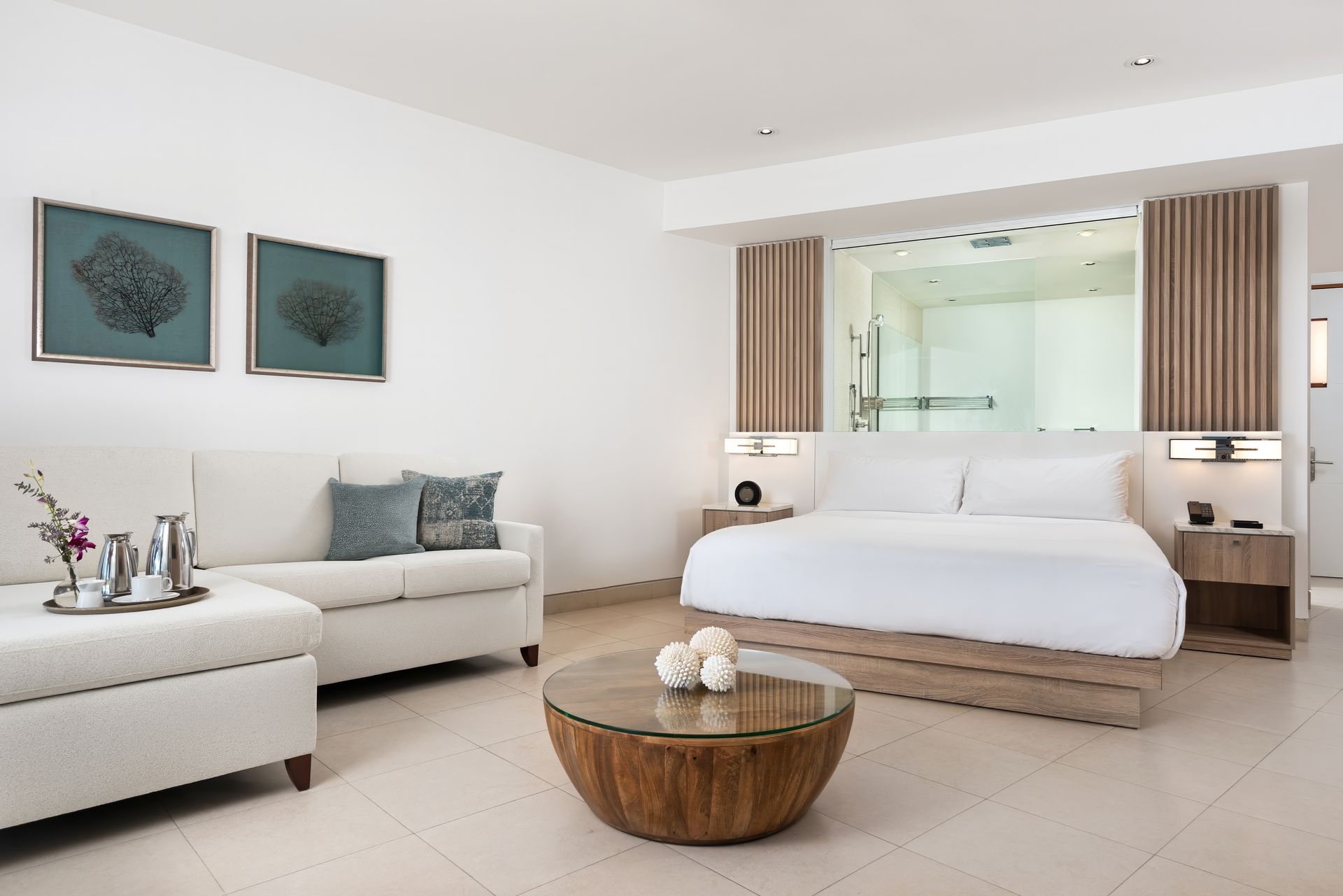 A hotel room with a large bed and a couch