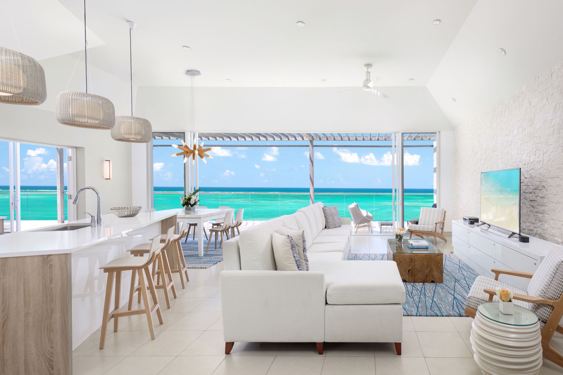 A living room with a view of the ocean