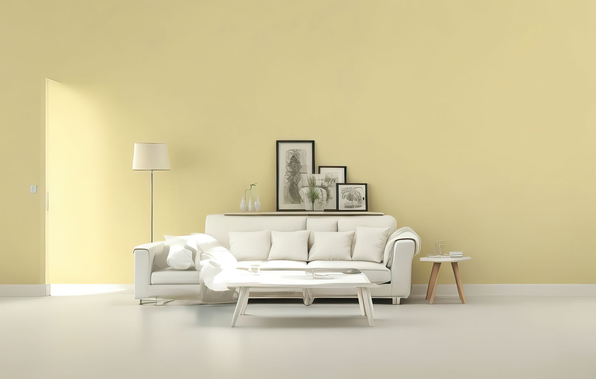 Minimalist living room with a white sofa, floor lamp, coffee table, and framed art on a pale yellow wall