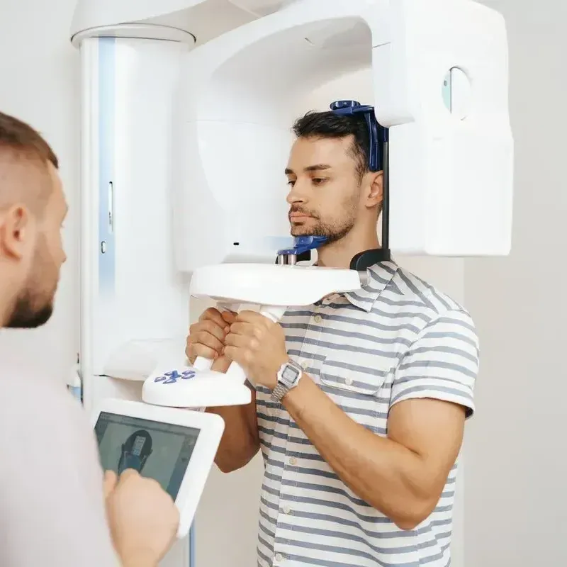 Get a CBCT scan from our family dentist in Marrero LA Cone beam computed tomography | Dental patient getting CBCT Scan | Marrero LA