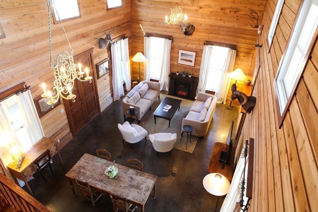 An aerial view of a living room in a log cabin