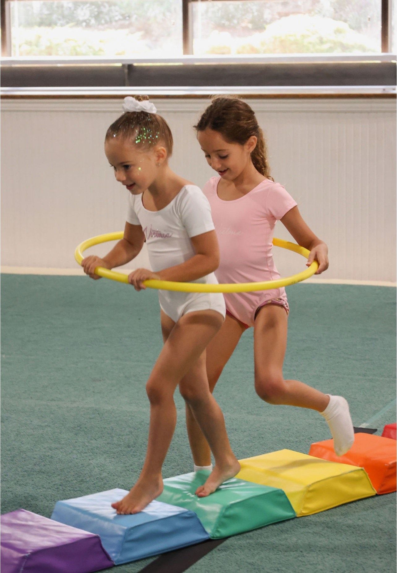Children playing with hula hoops at Aerials Gymnastics in Eatontown, NJ
