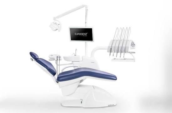 Blauw-witte tandartsstoel met aangesloten apparatuur en monitor.
