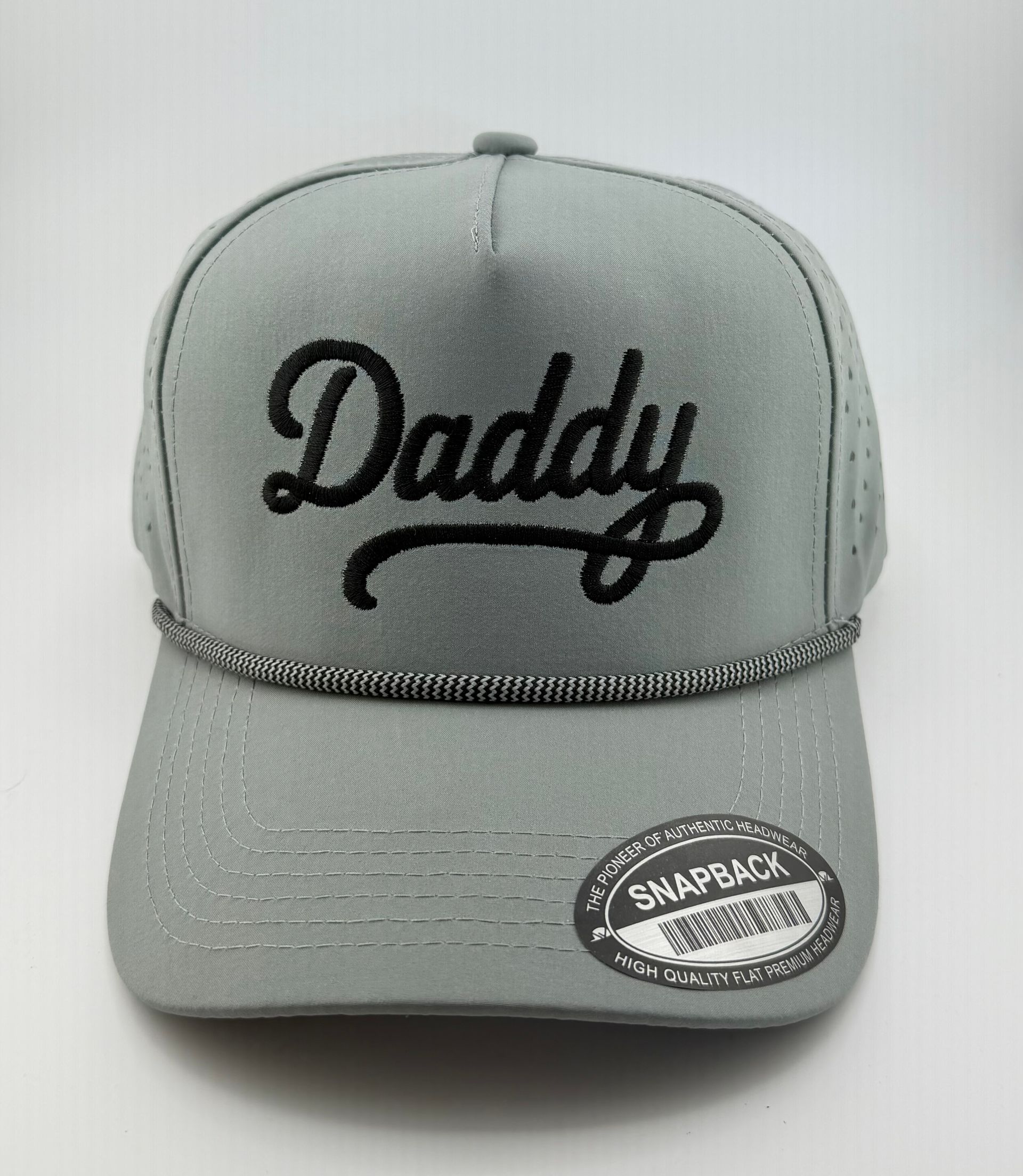 A grey snapback cap featuring the word 