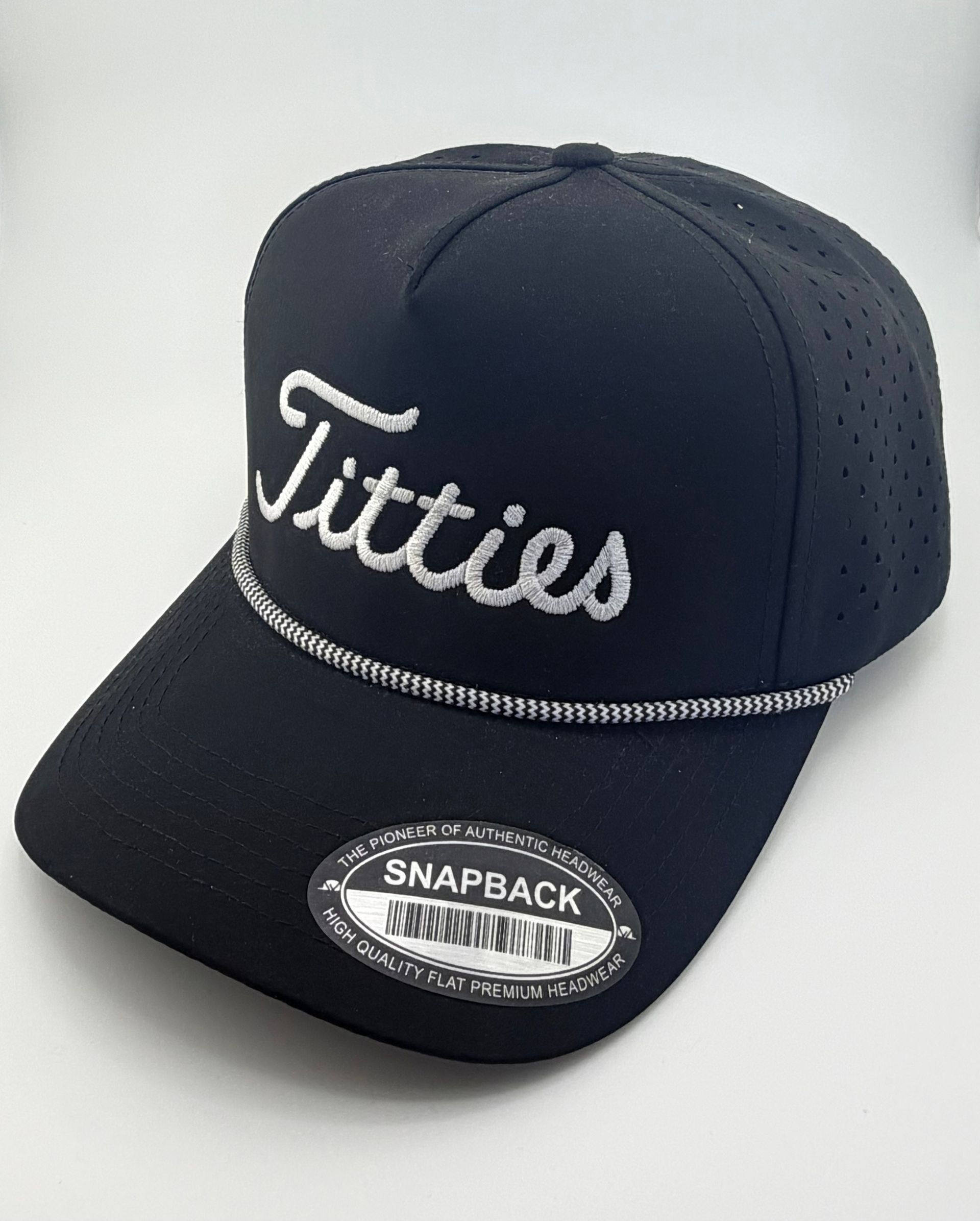 A black snapback baseball cap with a silver cord and the word 