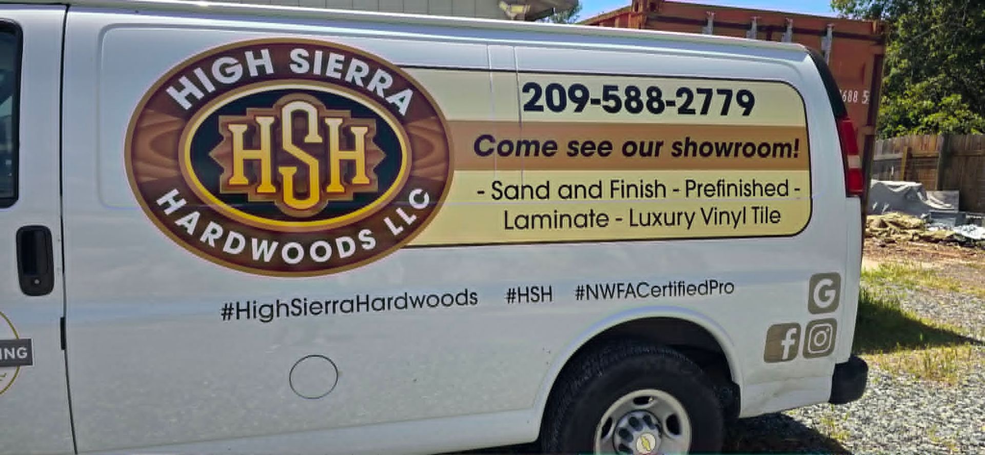 White High Sierra Hardwoods service van with company logo, phone number, and woodworking ad text