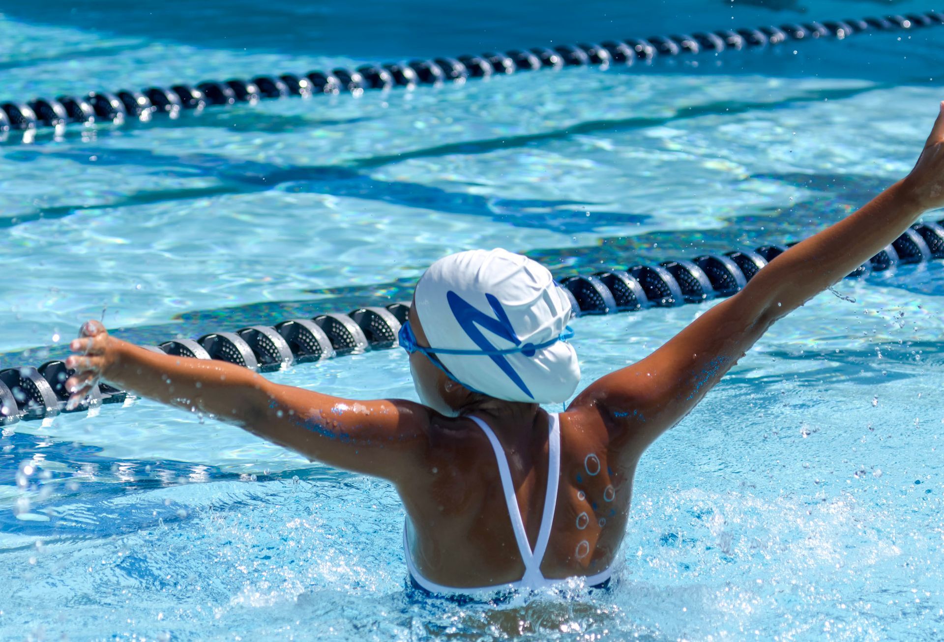 B-Town Brazadas Swim Club meet - swimmers at starting blocks at the East Side Aquatics Center in Bakersfield, CA