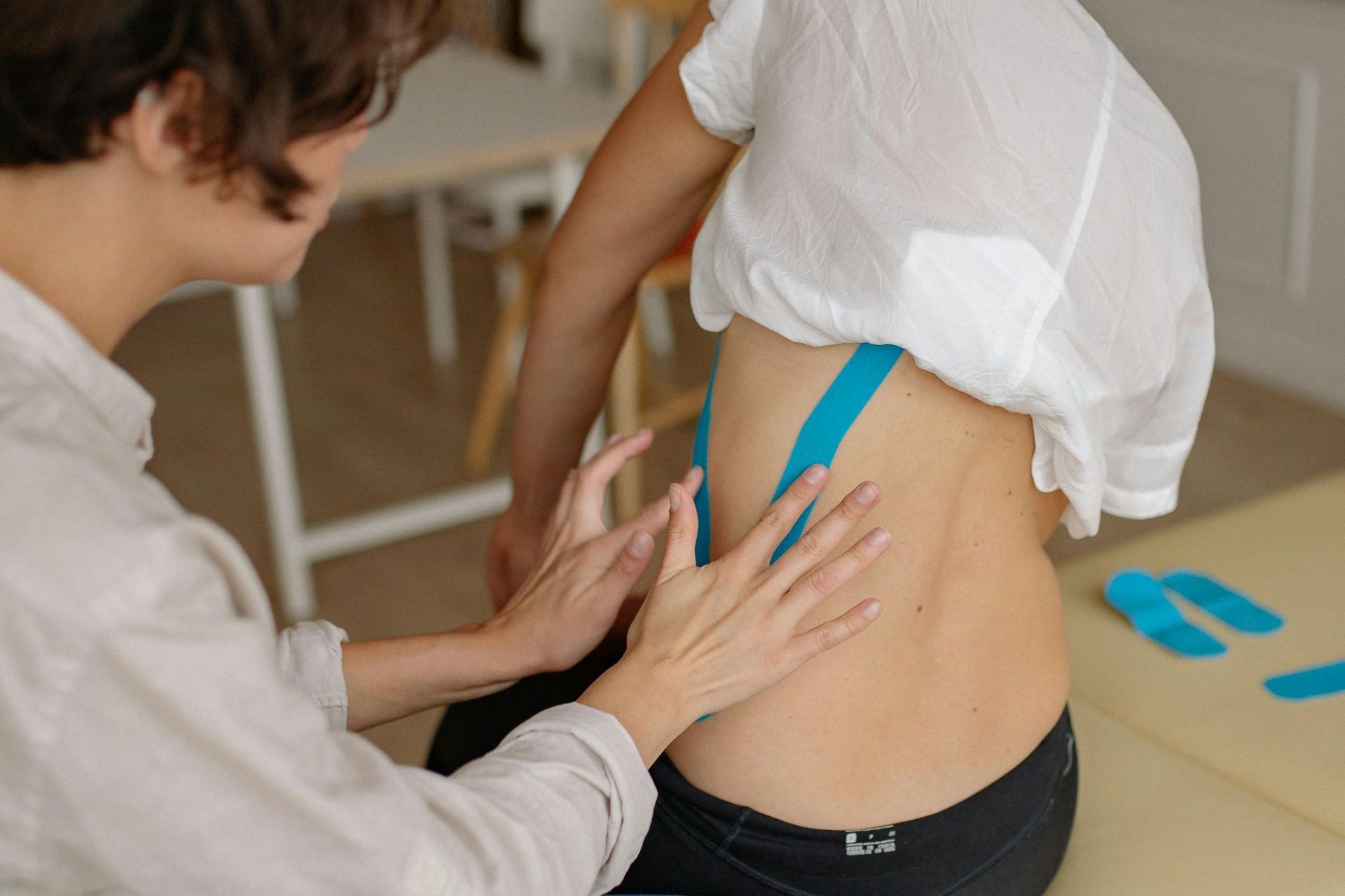 Photo of chiropractor doing interventional pain management to patient Photo of chiropractor doing interventional pain management to patient