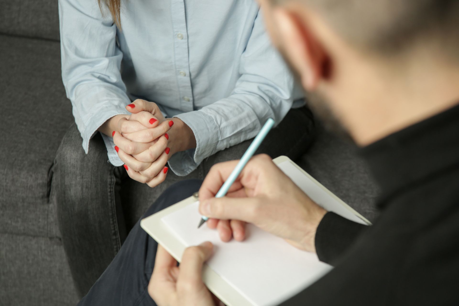 Depressed woman during psychotherapy.