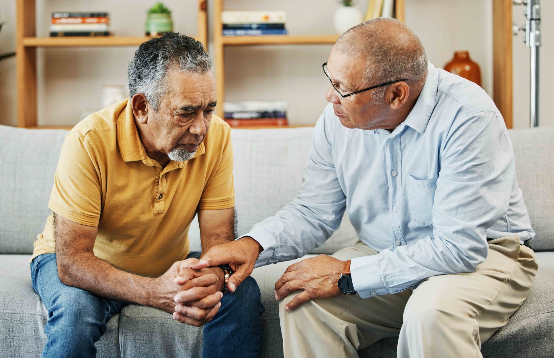 Elderly men having a conversation with a grief counselor. Elderly men having a conversation with a grief counselor.