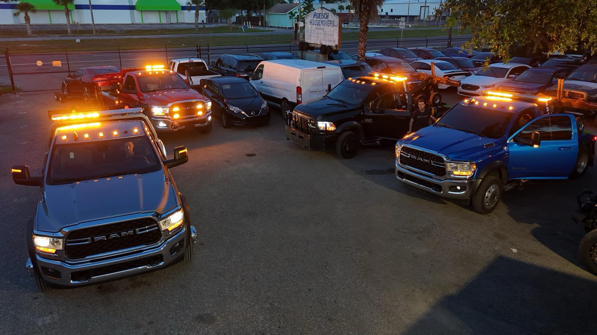 A bunch of trucks are parked in a parking lot