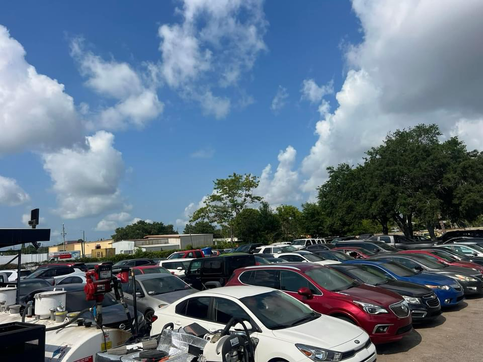 A lot of cars are parked in a parking lot.