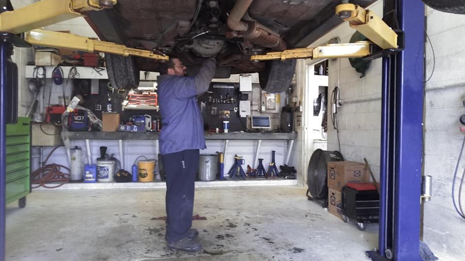Man Fixing Car | Danville, IL | Auto Mobile Diagnostics Man Fixing Car | Danville, IL | Auto Mobile Diagnostics
