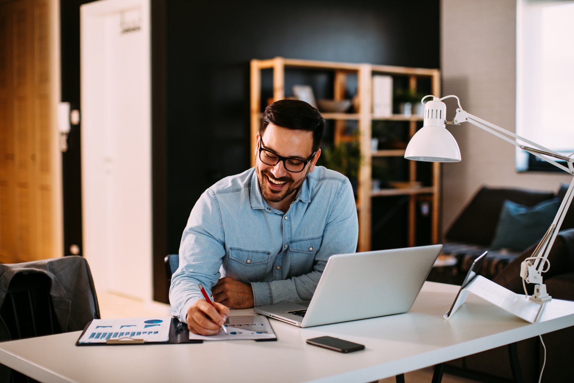 Young business man working at home with laptop