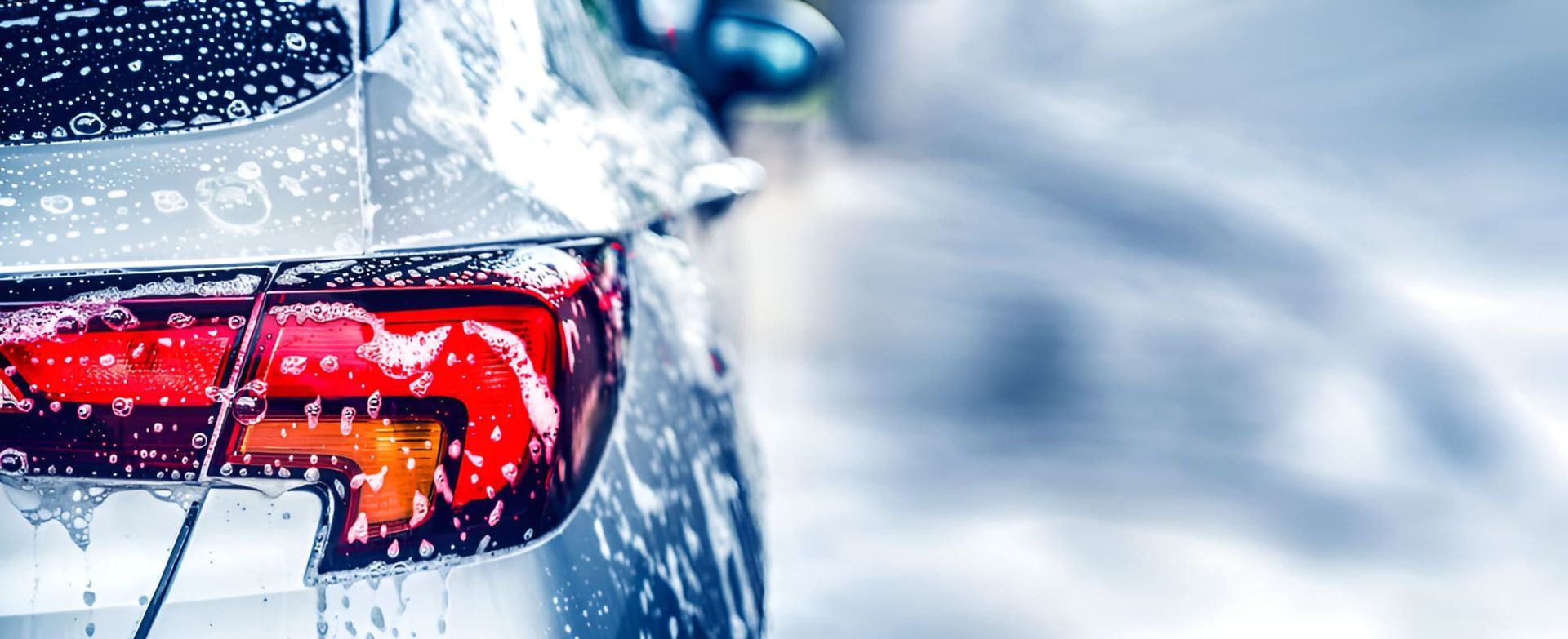 A Car Is Being Washed With Soap And Water — Country Dirt Blasters Mobile Car Detailing In Murwillumbah, NSW