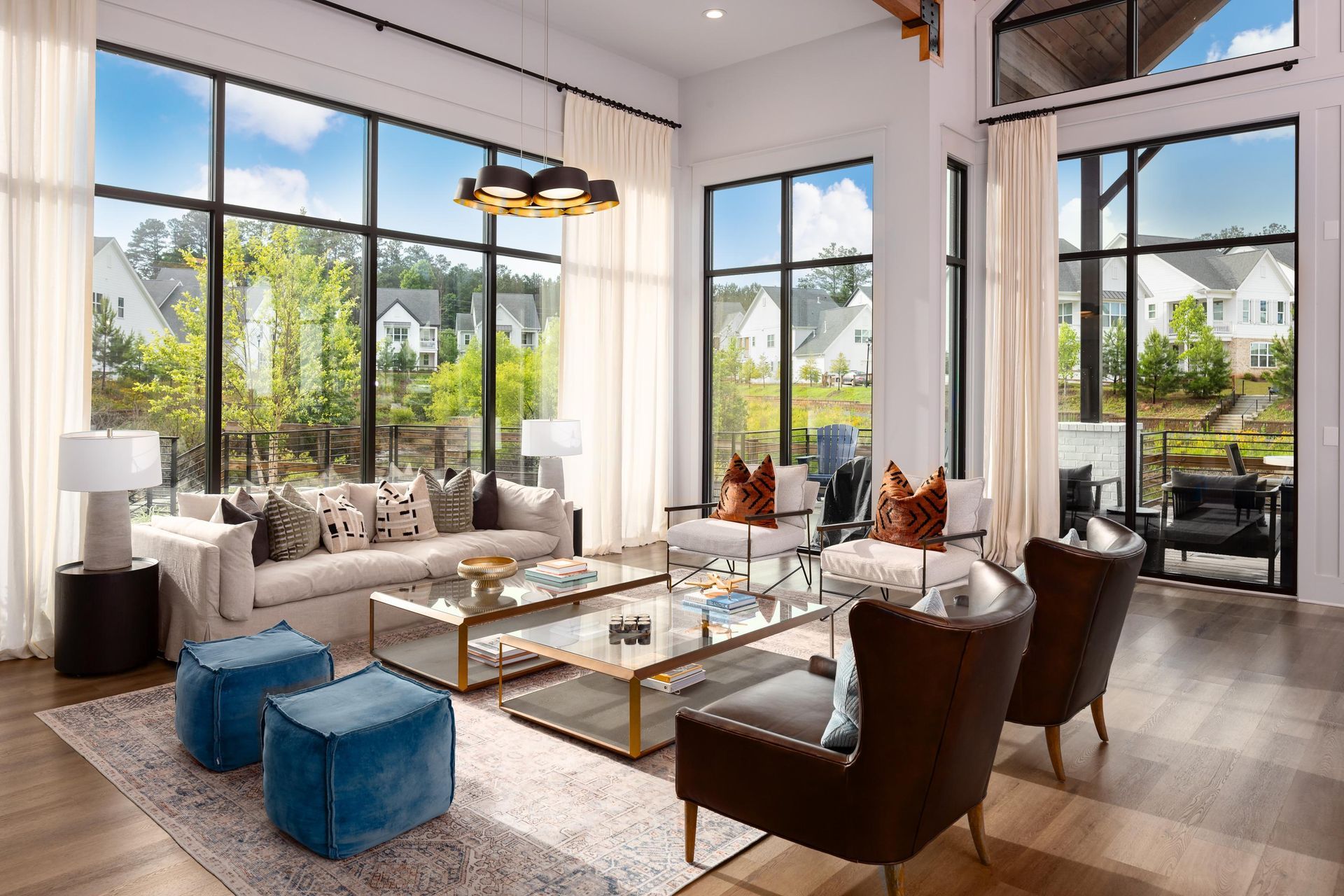 A living room with a lot of windows and furniture