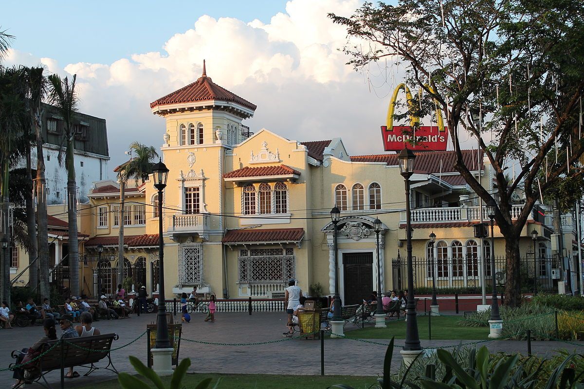 Historic Spanish colonial building with McDonald's sign in Poblacion Makati