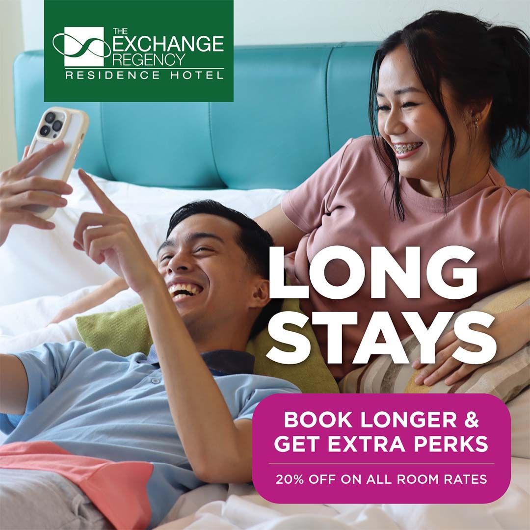 A man and a woman laying on a bed with the words long stays book longer and get extra perks