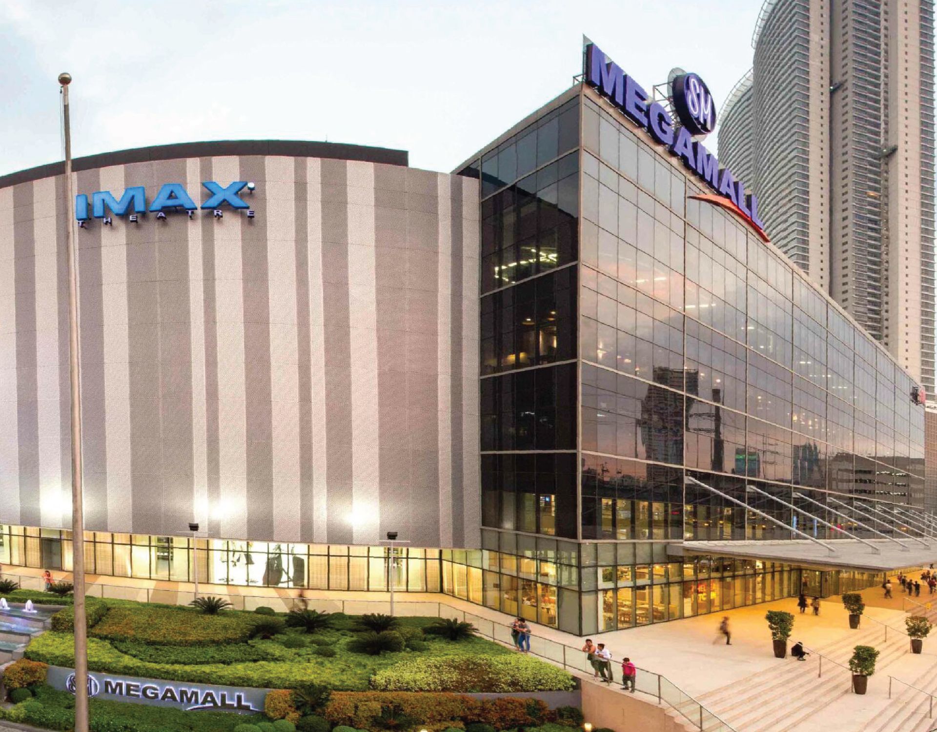 Exterior of SM Megamall in the Philippines, featuring an IMAX theater and glass-fronted building.