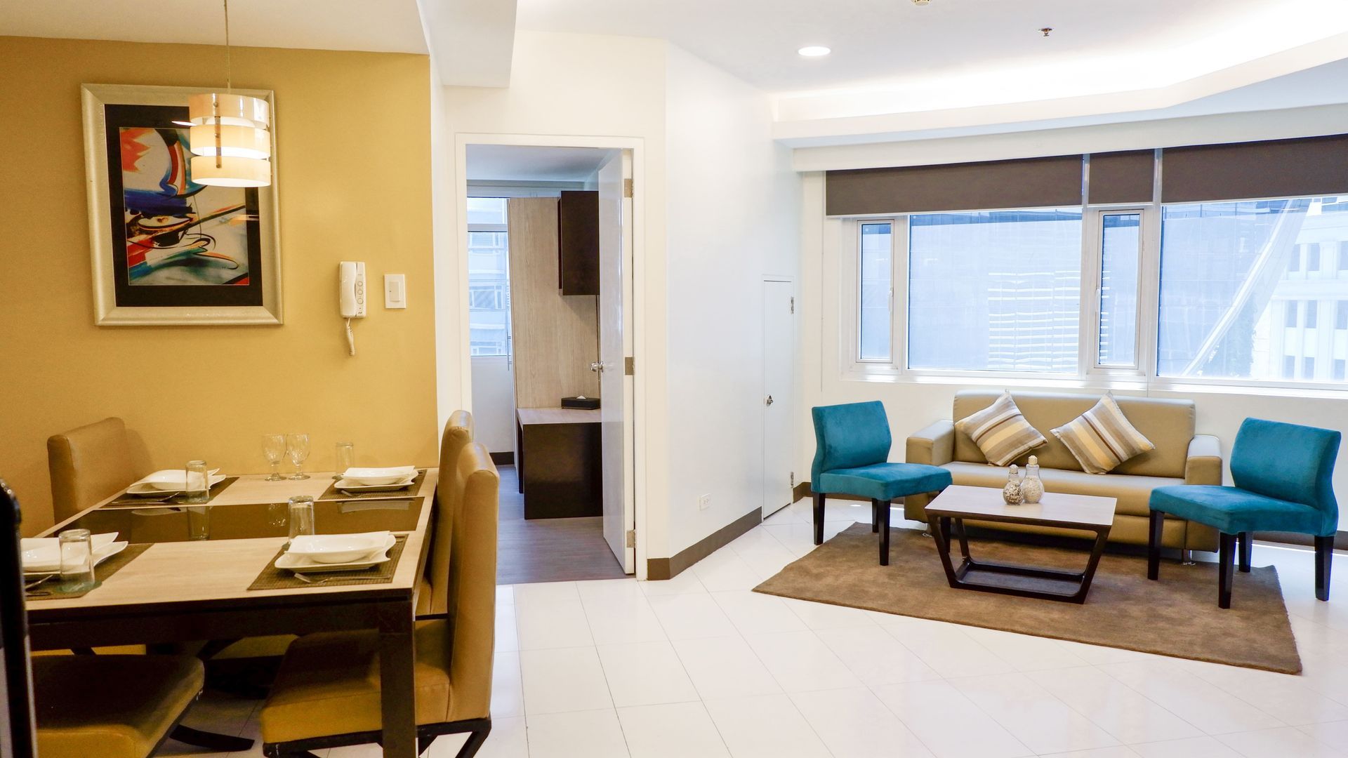 Bright open-plan living and dining area at The Exchange Regency Makati