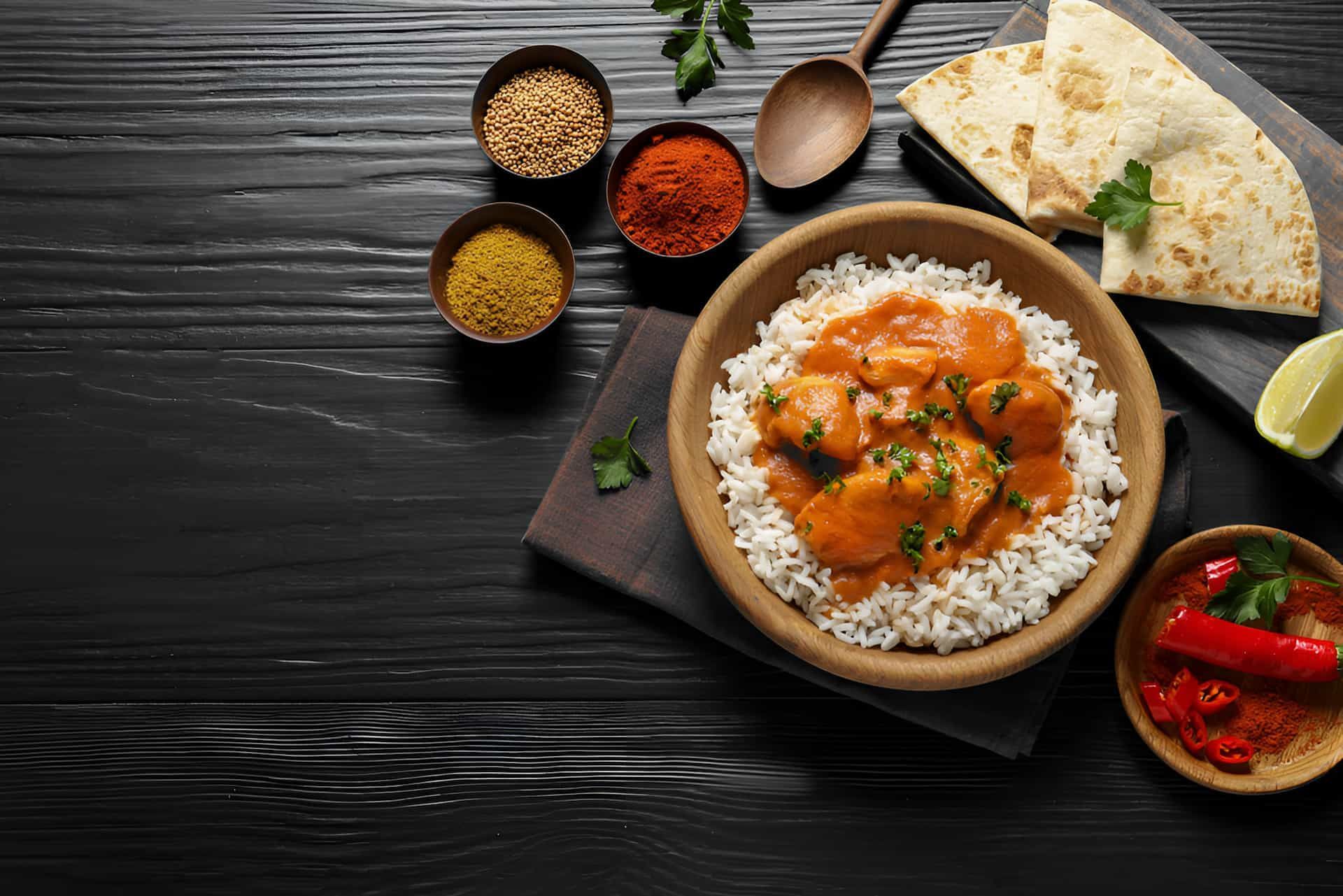 Butter Chicken and Rice with Spices— Punjabi Sunrise Restaurant In Alexandra Hills, QLD