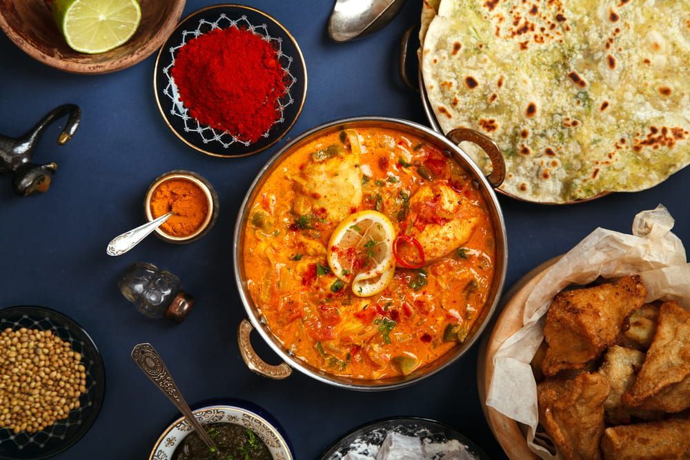 There Are Many Different Types Of Indian Food On The Table — Punjabi Sunrise Restaurant In Alexandra Hills, QLD