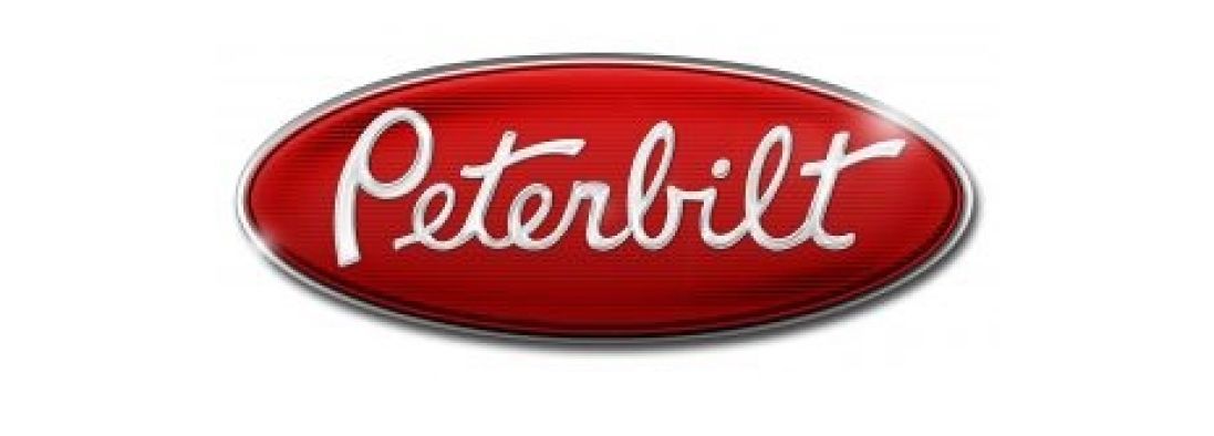 Logo Peterbilt de forme ovale rouge, avec le nom de la marque en cursive blanche.