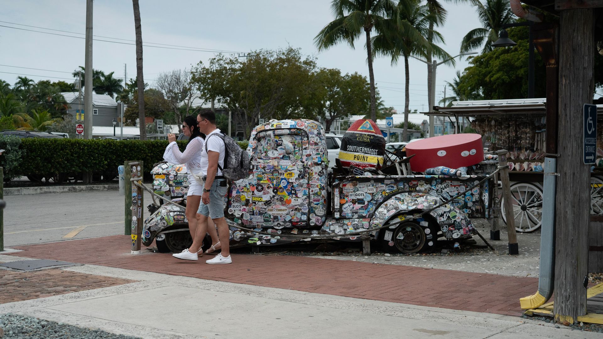 Passengers walking and enjoying a round trip bus tour from Miami to Key West in Duval Street