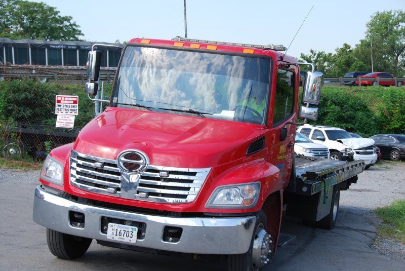 Red Towing Truck — Nashville, TN — Mike’s Custom Towing