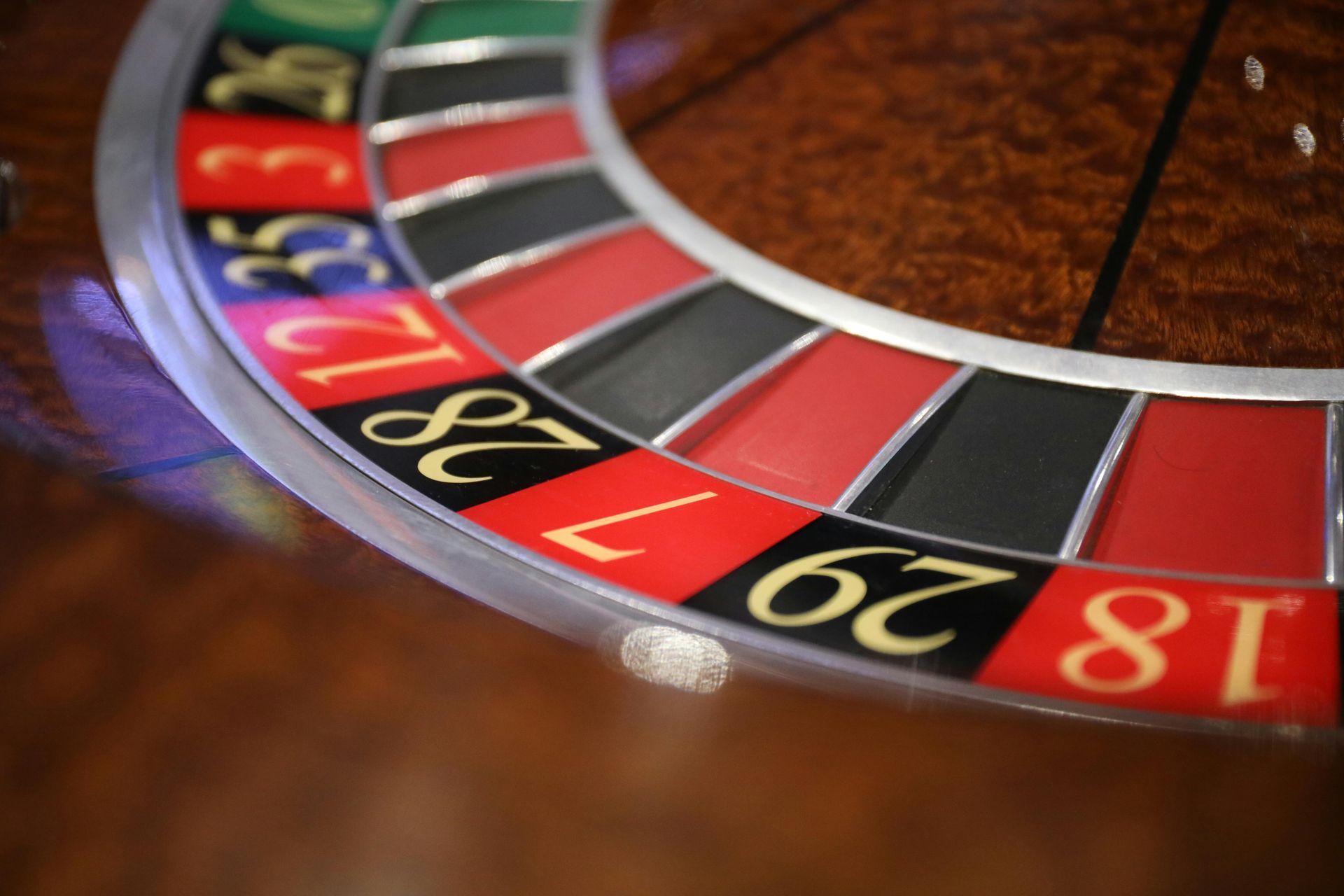 A close up of a roulette wheel with the number 28 on it