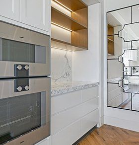 White Marbled Kitchen With Double Oven — Interior Design in Tweed Heads, NSW
