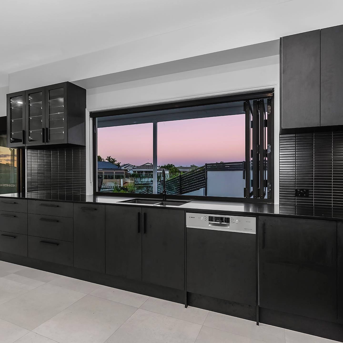 Modern Black Kitchen Cabinets with Black Benchtop — Interior Design in Tweed Heads, NSW